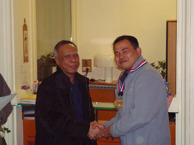 DSC00187.JPG - Captain Khairuddin giving out the medal